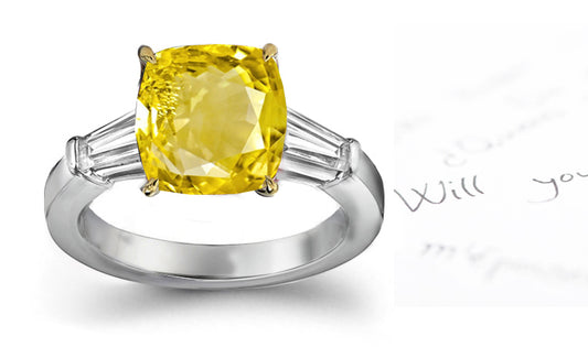 engagement ring three stone with cushion yellow sapphire center and side baguette diamonds