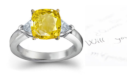 engagement ring three stone with cushion yellow sapphire center and side trillion diamonds