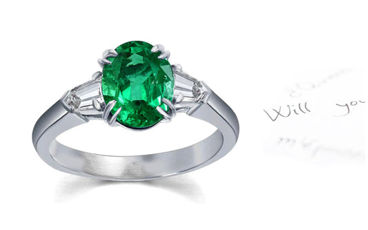 106 custom made unique oval cut emerald center stone and bullet diamond side three stone engagement ring