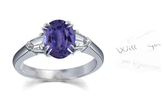 106 custom made unique oval cut purple sapphire center stone and bullet diamond side three stone engagement ring