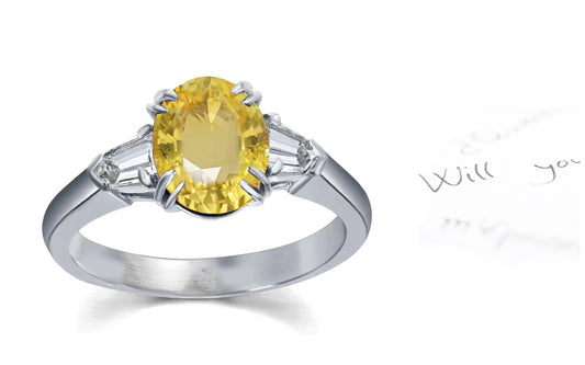 106 custom made unique oval cut yellow sapphire center stone and bullet diamond side three stone engagement ring