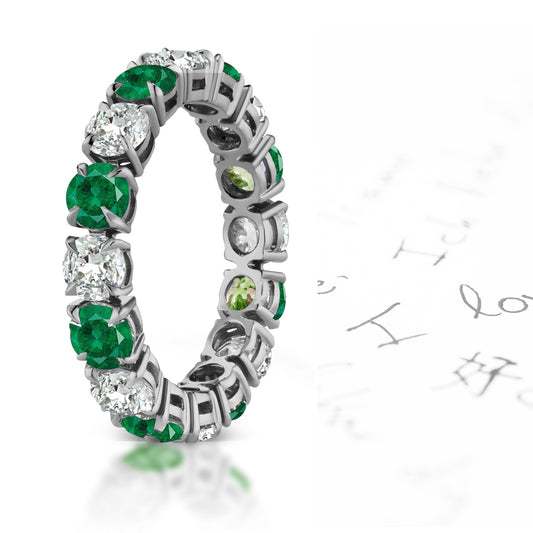 109 custom made unique stackable alternating round cut emerald and diamond prong set eternity ring