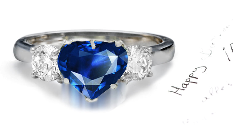 engagement ring three stone with heart blue sapphire center and side round diamonds