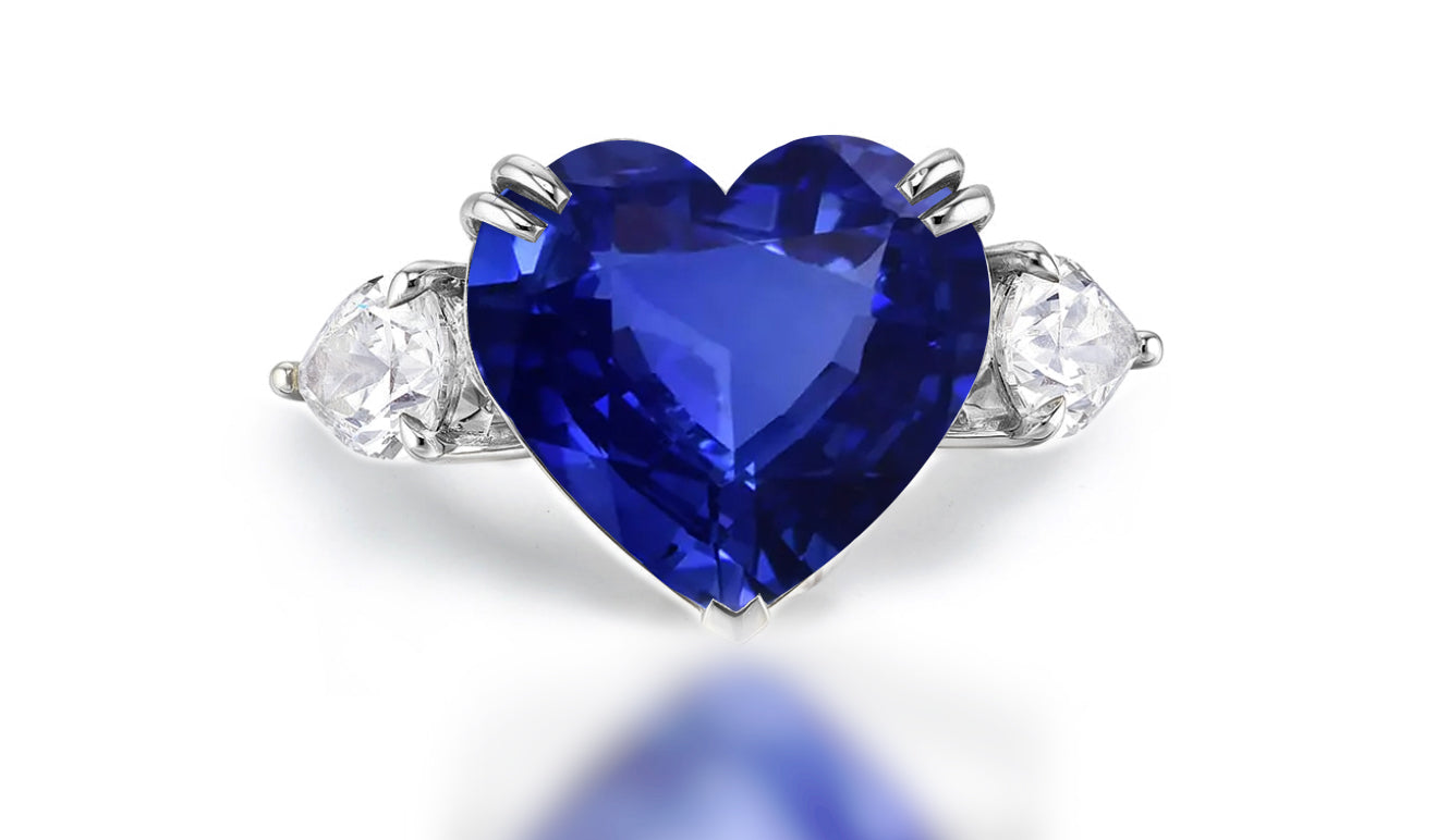 Custom made blue sapphire and diamond three stone engagement rings