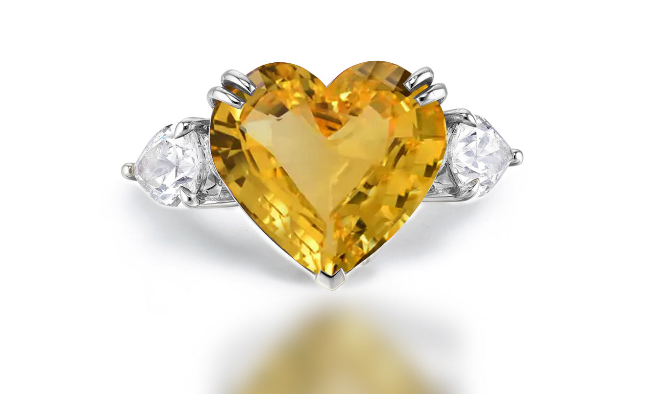 Custom made yellow sapphire and diamond three stone engagement rings