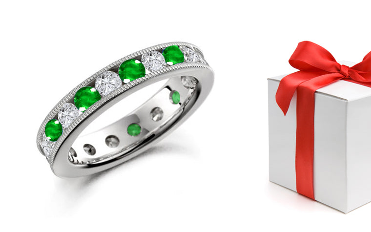 stackable eternity ring alternating with channel set round emeralds and diamonds