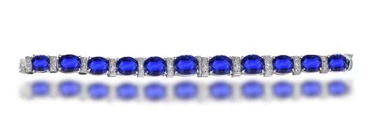 13 custom unique alternating oval blue sapphire and diamond halo tennis bracelet