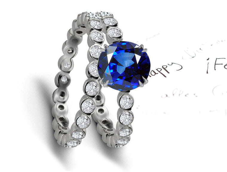 engagement ring with round blue sapphire center & matching wedding band with round blue sapphires and diamonds