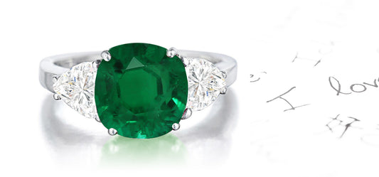 159 custom made unique round emerald center stone and heartt diamond accents three stone engagement ring