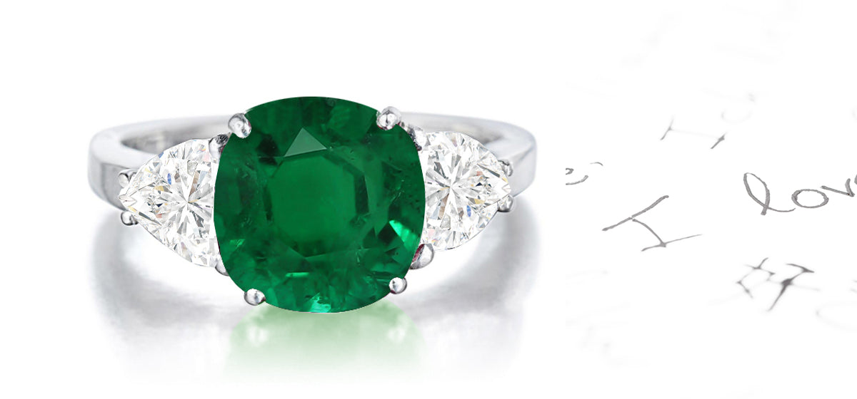 159 custom made unique round emerald center stone and heartt diamond accents three stone engagement ring