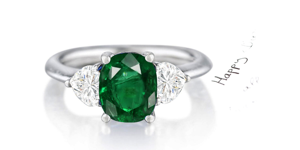 162 custom made unique oval emerald center stone and heart diamond accents three stone engagement ring