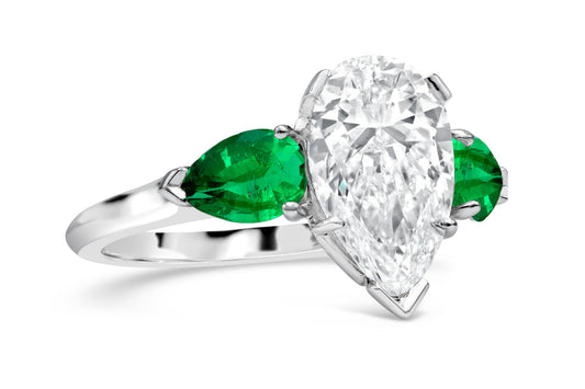 192 custom made unique pear shaped diamond center stone and pear emerald accents three stone engagement ring