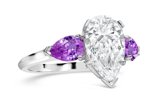 192 custom made unique pear shaped diamond center stone and pear purple sapphire accents three stone engagement ring