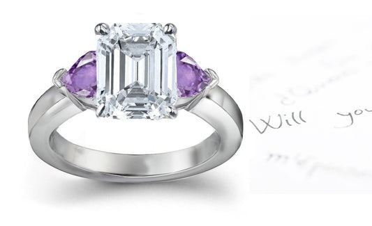 engagement ring with emerald cut diamond center and side heart purple sapphires