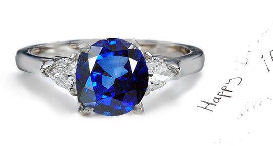 engagement ring three stone with round blue sapphire and trillion diamonds