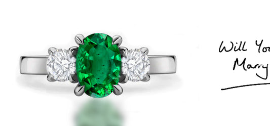 286 custom made unique oval emerald center stone and round diamond accent three stone engagement ring