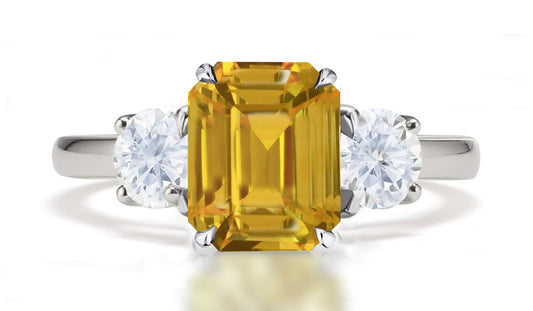290 custom made unique emerald cut yellow sapphire center stone and round diamond accent three stone engagement ring