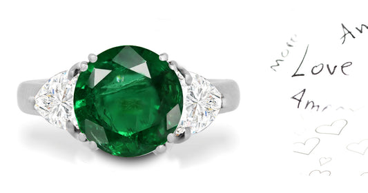 297 custom made unique round emerald center stone and heart diamond accent three stone engagement ring