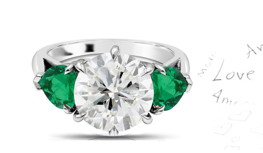 301 custom made unique round diamond center stone and heart emerald accent three stone engagement ring
