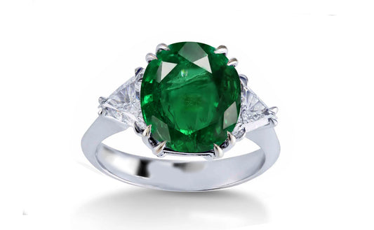 304 custom made unique oval emerald center stone and trillion diamond accent three stone engagement ring