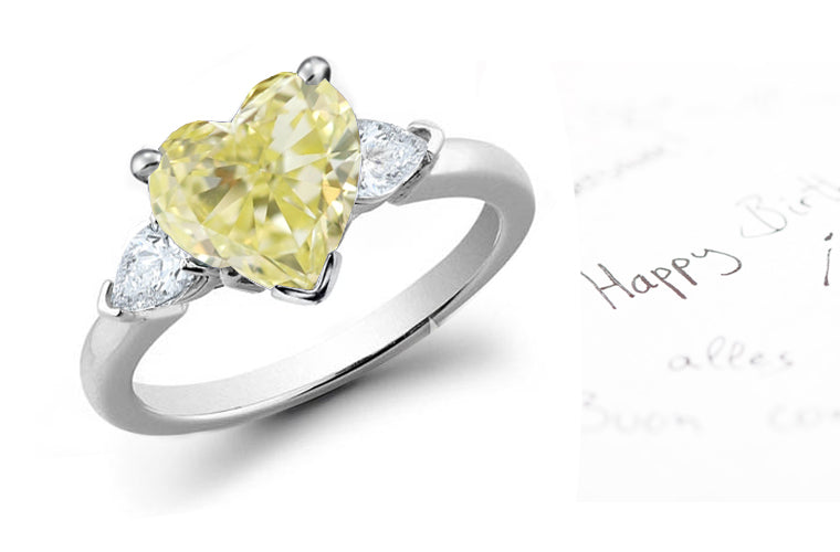 engagement ring three stone with heart yellow diamond center and side pear white diamonds