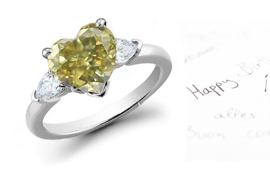 engagement ring three stone with heart green diamond center and side white pear diamonds