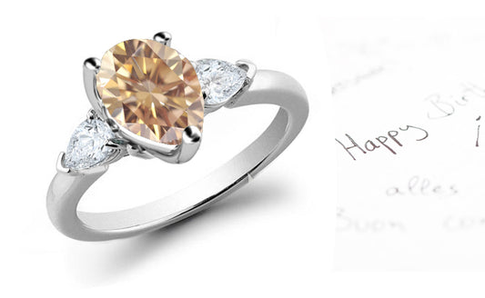 engagement ring three stone with pear brown diamond center and side pear white diamonds