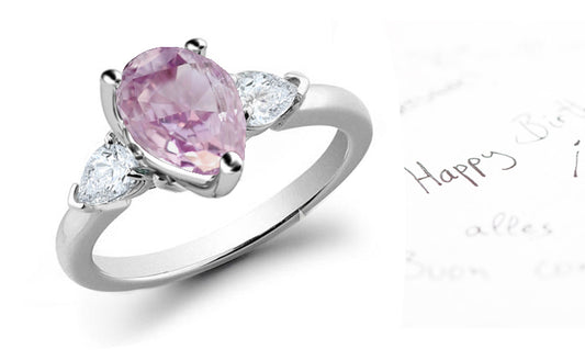 engagement ring three stone with pear pink diamond center and side pear white diamonds