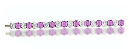 4 custom unique alternating oval pink sapphire and diamond tennis bracelet.