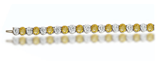 4 custom unique alternating oval yellow sapphire and diamond tennis bracelet.