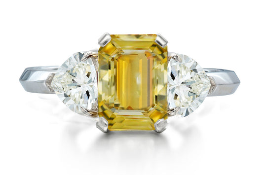 517 custom made unique emerald cut yellow sapphire center stone and heart diamond accent three stone engagement ring