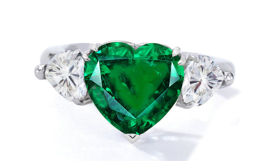 522 custom made unique heart emerald center stone and heart diamond accent three stone engagement ring
