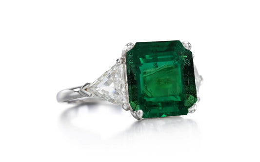 525 custom made unique asscher cut emerald center stone and trillion diamond accent three stone engagement ring