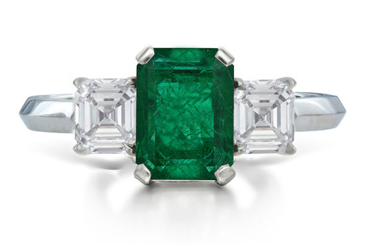 526 custom made unique emerald cut emerald center stone and asccher cut diamond accent three stone engagement ring