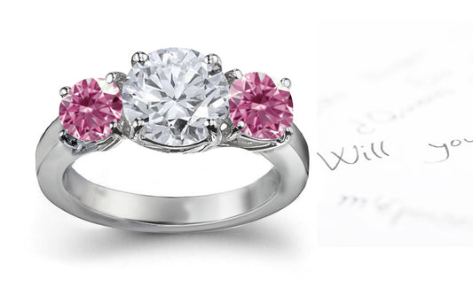 engagement ring three stone with round white diamond center and side pink round diamonds