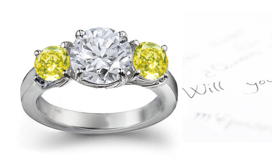 engagement ring three stone with round white diamond center and side yellow round diamonds