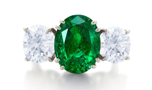 550 custom made unique oval emerald center stone and round diamond accent three stone engagement ring