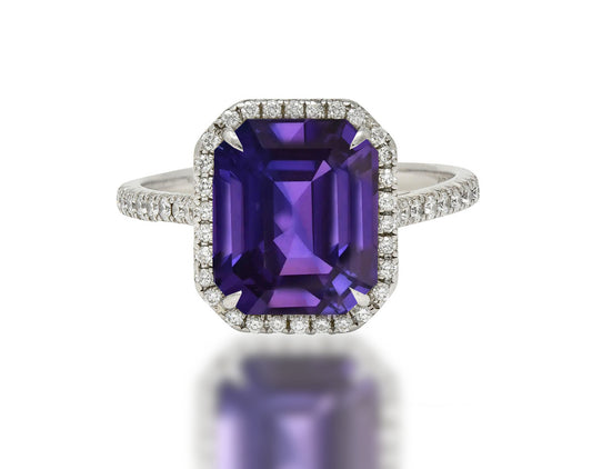 555 custom made unique emerald cut purple sapphire center stone and round diamond halo engagement ring