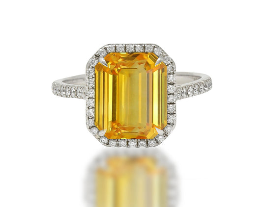 555 custom made unique emerald cut yellow sapphire center stone and round diamond halo engagement ring