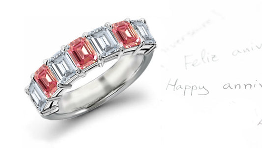 anniversary ring seven stone with alternating emerald cut pink and white diamonds