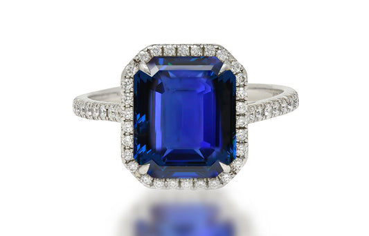 611 custom made unique blue sapphire cut emerald center stone and diamond halo engagement ring
