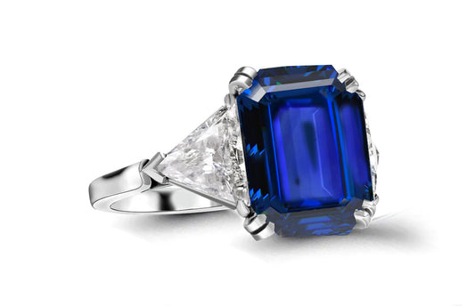 613 custom made unique emerald cut blue sapphire center stone and trillion diamond side three stone engagement ring