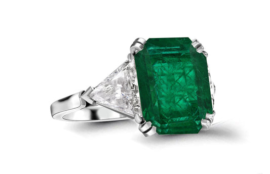 613 custom made unique emerald cut emerald center stone and trillion diamond side three stone engagement ring