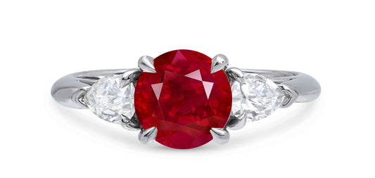 614 custom made unique round ruby center stone and pears diamond side three stone engagement ring