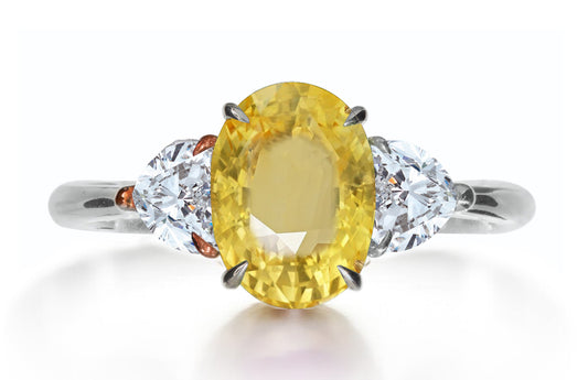 615 custom made unique oval yellow sapphire center stone and heart diamond side three stone engagement ring