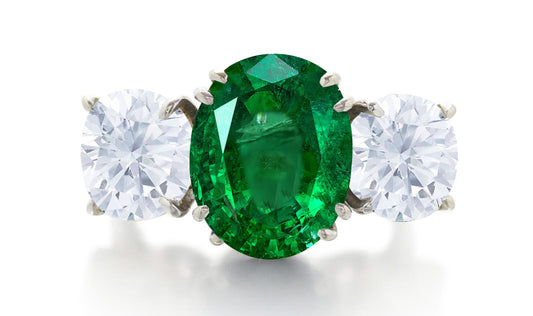 619 custom made unique oval emerald center stone and oval diamond side three stone engagement ring