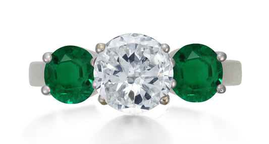 622 custom made unique round diamond center stone and round emerald accent three stone engagement ring