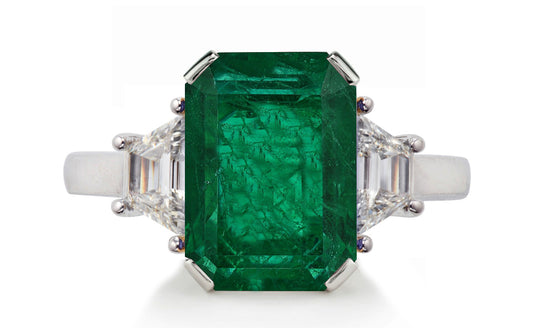 623 custom made unique emerald cut emerald center stone and trapezoid diamond accent three stone engagement ring