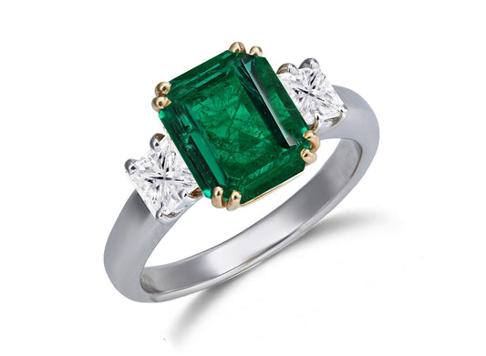 624 custom made unique emerald cut emerald center stone and square diamond accent three stone engagement ring