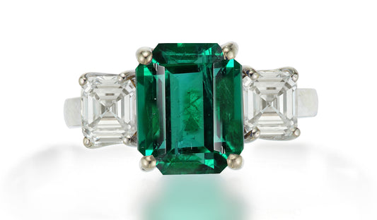 625 custom made unique emerald cut emerald center stone and asscher cut diamond accent three stone engagement ring